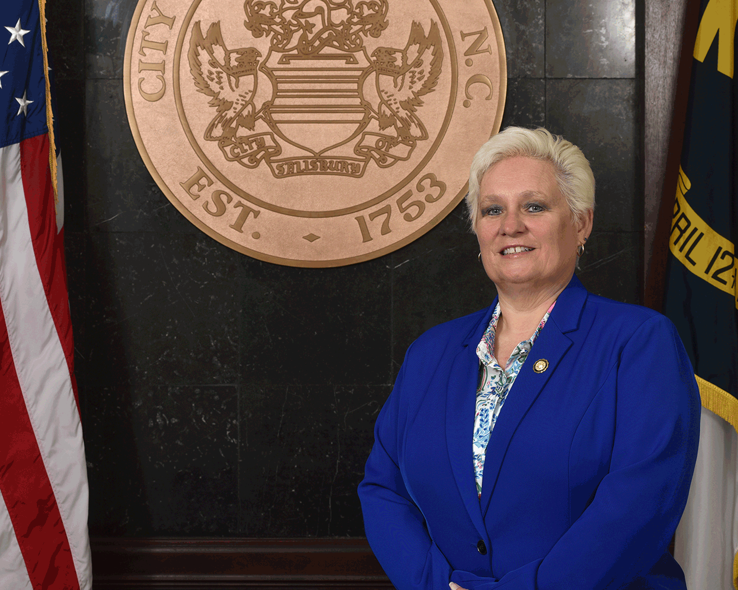 Portrait of Mayor Sheffield in front of city seal