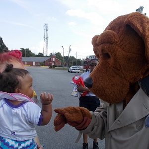 McGruff the Crime Dog meeting a young girl and her mother