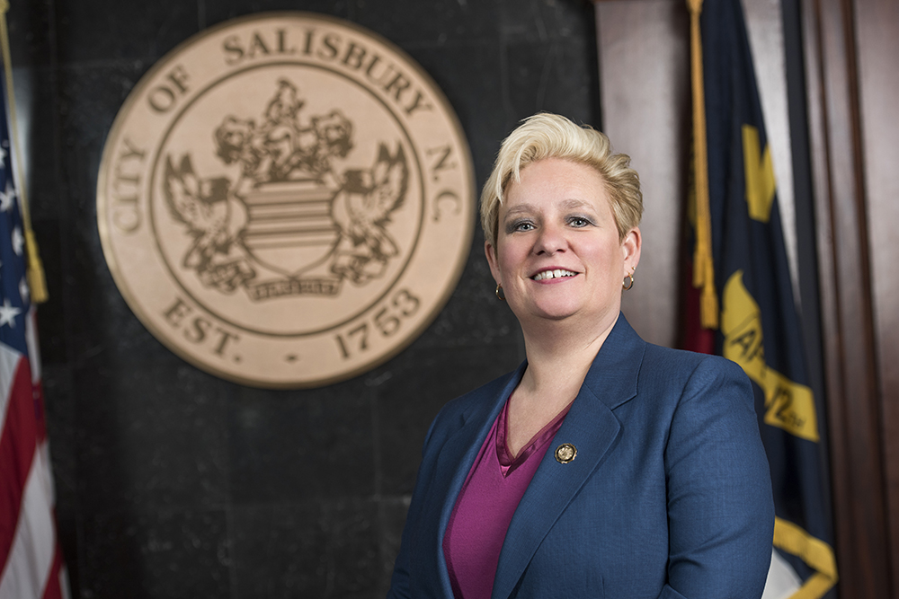 Portrait of Mayor Pro Tem Tamara Sheffield in front of city seal